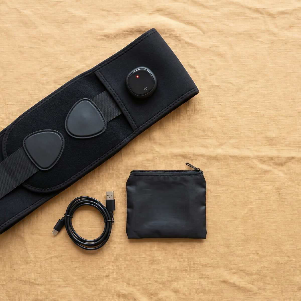 Unknot Heat Belt with its USB-C cable and carry pouch